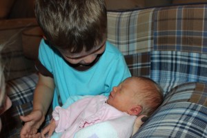 In awe of his baby sister