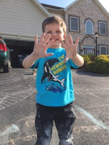 This boy loves to chalk